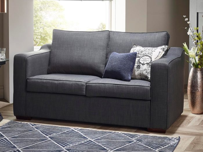 Two-seater sofabed with scatter cushions